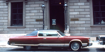 Banner Image: A 1975 Chrysler Imperial LeBaron parked in front of the Athenaeum in 1976.