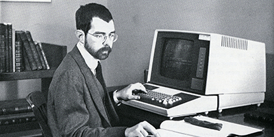 Banner Image: The Athenaeum embraces technology...bibliographer Keith Kamm inputs cataloging data into an OCLC terminal in 1979.