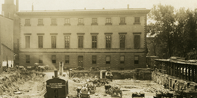 Banner Image: The north elevation of the Athenaeum during construction of the Penn Mutual Building, August 8, 1913.  This was the only time when there was a clear view of the Athenaeum's north side from Walnut St.  